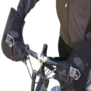 Cyclist wearing black Bar Mitts handlebar covers on a mountain bike