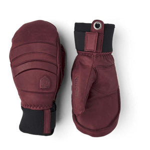 Pair of burgundy Hestra leather mittens with black cuffs