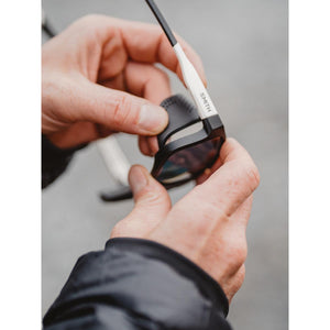 Hands attaching a side shield to Smith sunglasses