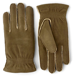 Hestra olive green suede gloves with exposed seams and elasticated wrists