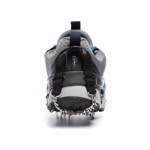 Black Diamond traction device attached to the heel of a grey trail running shoe