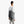 Person wearing a grey Bellroy tote bag over their shoulder
