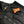 California Heat battery pack inside the zippered pocket of a black heated vest