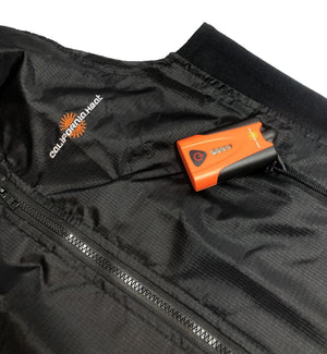 California Heat battery pack inside the zippered pocket of a black heated vest