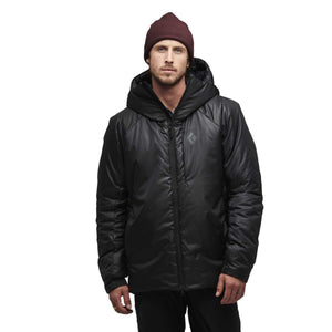 Man wearing a black Black Diamond hooded insulated jacket and a maroon beanie