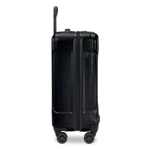 Side view of a black Briggs and Riley hard shell carry on suitcase with four wheels and an extended handle
