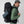 Person wearing a black FjallRaven hiking backpack with a small blue pouch attached to the side
