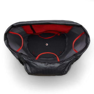 Top down view of open Black Diamond climbing bag with black grid pattern and red interior accents