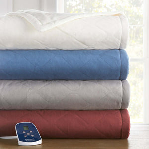 Stack of four Shavel heated blankets in white blue grey and red with a digital controller