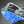 Winter Walking ice cleats with blue rubber traction sole and metal chains attached to a black boot
