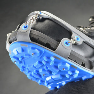 Winter Walking ice cleats with blue rubber traction sole and metal chains attached to a black boot