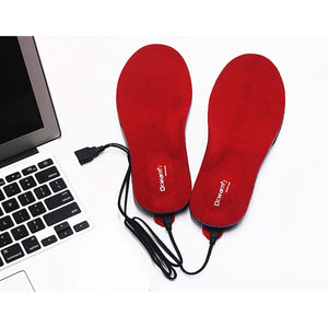 Dr Warm heated insoles with USB cables next to a laptop