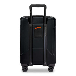 Back view of black Briggs and Riley carry on suitcase with extended handle and four wheels
