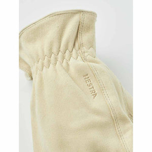 Beige suede Hestra glove cuff with elasticated wrist detail
