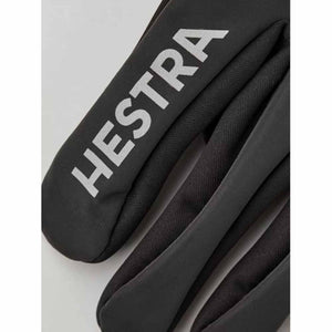 Black Hestra glove with reflective brand logo