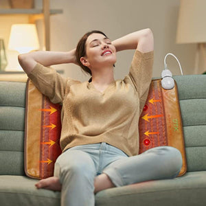 Woman sitting on a couch using a UTK Technology infrared heating pad