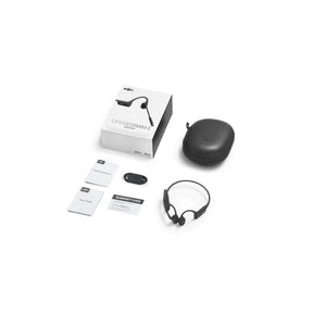 Shokz OpenComm2 bone conduction headset with packaging, carrying case, charging cable, and documentation
