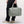 Person holding a sage green Got Bag duffel bag