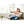 Couple sitting on a couch using a HealthyLine remote control