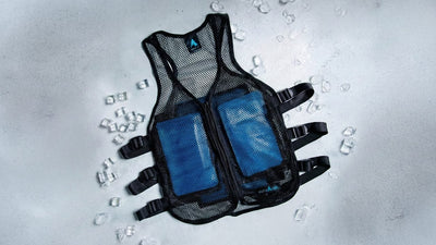 Black mesh cooling vest with two blue ice packs, adjustable side straps, and an 