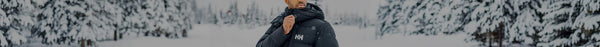 A man in a dark puffy jacket with an 