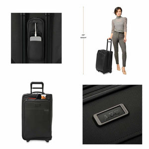 Briggs and Riley black luggage showing charging port, scale reference, front pocket, and monogram plate