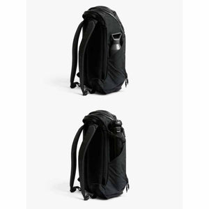 Bellroy black backpack showing side pocket with water bottle