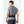 Man wearing a black Nathan running belt over a grey t-shirt