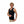 Man wearing a black Glovii heated tank top pointing to the red power button on the side