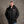 Man wearing a black San Francisco 49ers heated puffer jacket with a beanie