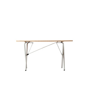 Side view of a rectangular folding table with a wood top and silver metal legs