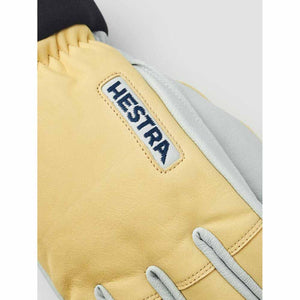 Close up of yellow and grey Hestra leather glove
