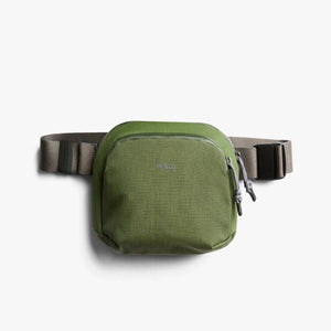 Bellroy olive green sling bag with adjustable strap and front zipper