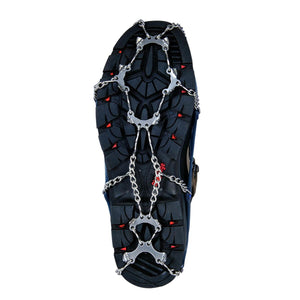 Snowline traction spikes attached to the sole of a hiking boot