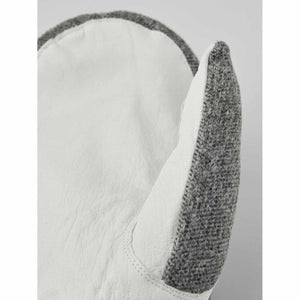 Close up of Hestra white leather and grey wool mitten