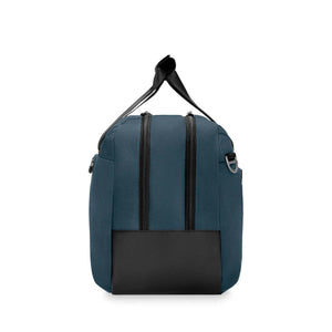 Blue Briggs and Riley duffel bag side view with black leather base and dual zipper closure