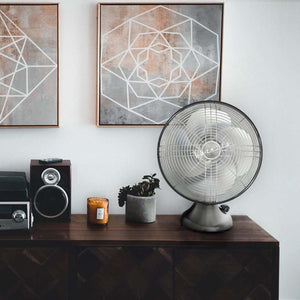 Vornado metal desk fan on a wooden console table
