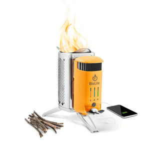 BioLite CampStove 2 plus with flames and a smartphone charging via USB cable