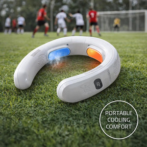 White wearable neck fan with blue and orange cooling plates on grass field with soccer players in background