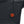 Black quilted fabric with a circular power button glowing red with a heat wave icon
