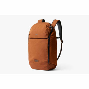 Bellroy copper colored backpack with black zippers and shoulder straps