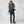 Woman wearing FjallRaven trekking trousers and backpack with hiking boots and cap