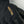 Black Hestra glove with gold embroidered logo and stitching