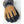 Hestra brown and grey winter glove with black textured fingertips and wrist strap