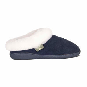 Navy blue suede slipper with white sheepskin lining and branded tag
