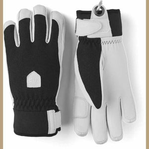 Hestra black and white leather gloves with adjustable wrist straps