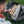 Person placing firewood into a grey BioLite gear bag on grass