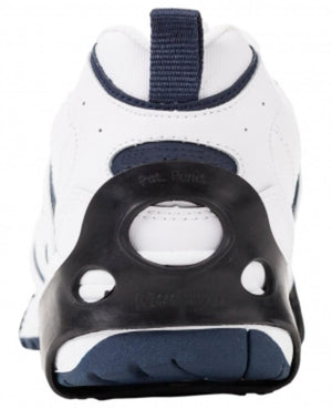 Due North ice traction cleat attached to the heel of a white sneaker