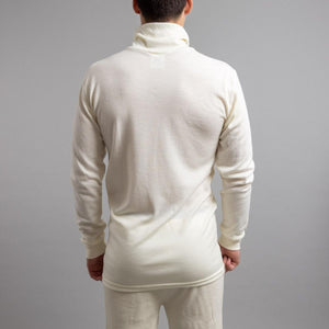 Back view of a person wearing a cream Merino Skins long sleeve turtleneck thermal top