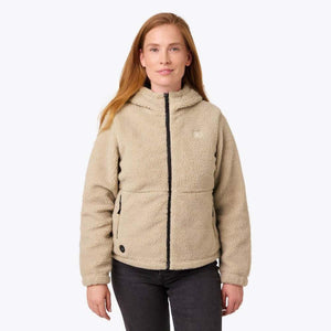 Woman wearing a beige Mobile Warming hooded fleece jacket with a black front zipper